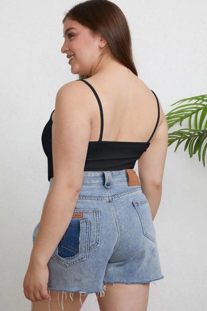 Plus size Basic Bae full-size round neck slim cami by Trendsi, featuring a close-up of the soft, fitted fabric and neckline.