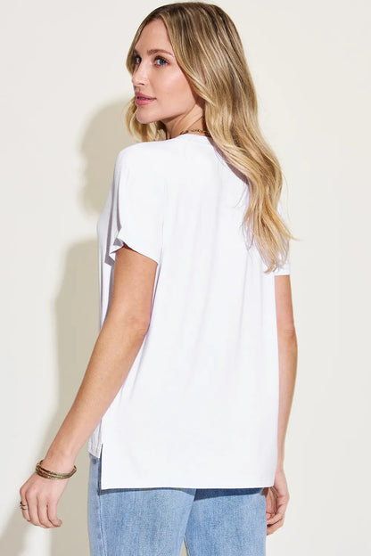 Basic Bae full-size V-neck high-low T-shirt by Trendsi, featuring a stylish V-neckline and a trendy high-low hem design.