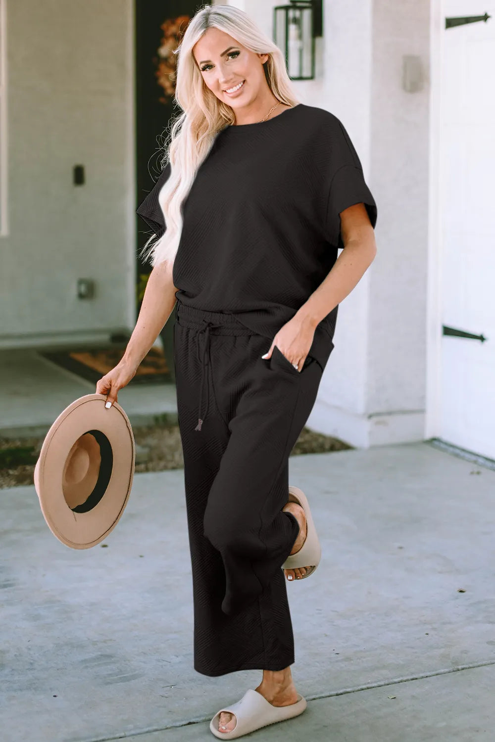 Double Take full size texture short sleeve top and pants set by Trendsi, featuring a stylish, comfortable matching outfit with textured fabric.