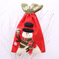 Red drawstring Christmas gift bag from Trendsi with festive holiday design, ideal for wrapping presents during the holiday season.