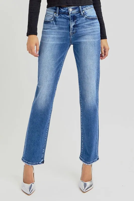 Risen mid-rise ankle tapered jeans in classic blue denim with subtle fading and stitching, stylish and versatile for everyday wear.