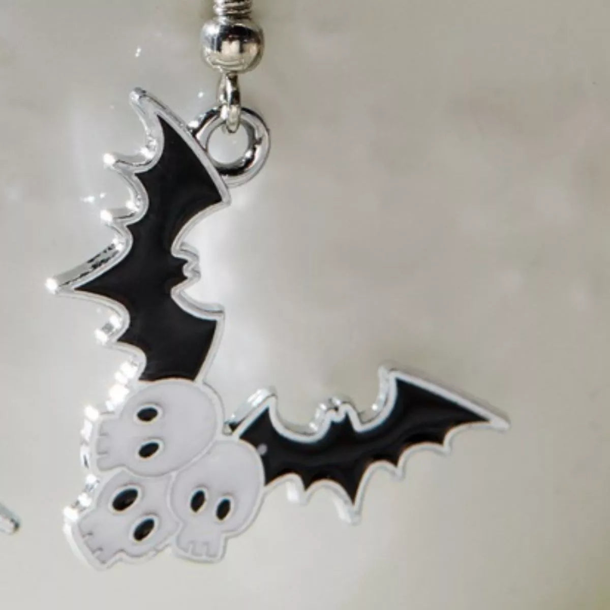 Black Halloween bat drop earrings from Trendsi featuring vampire bat design, perfect for spooky seasonal accessories.