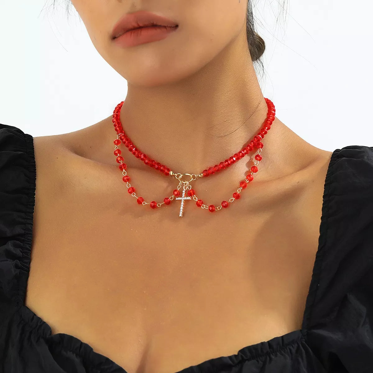 Halloween beaded cross pendant necklace by Trendsi featuring black beads and a silver cross pendant on a delicate chain.