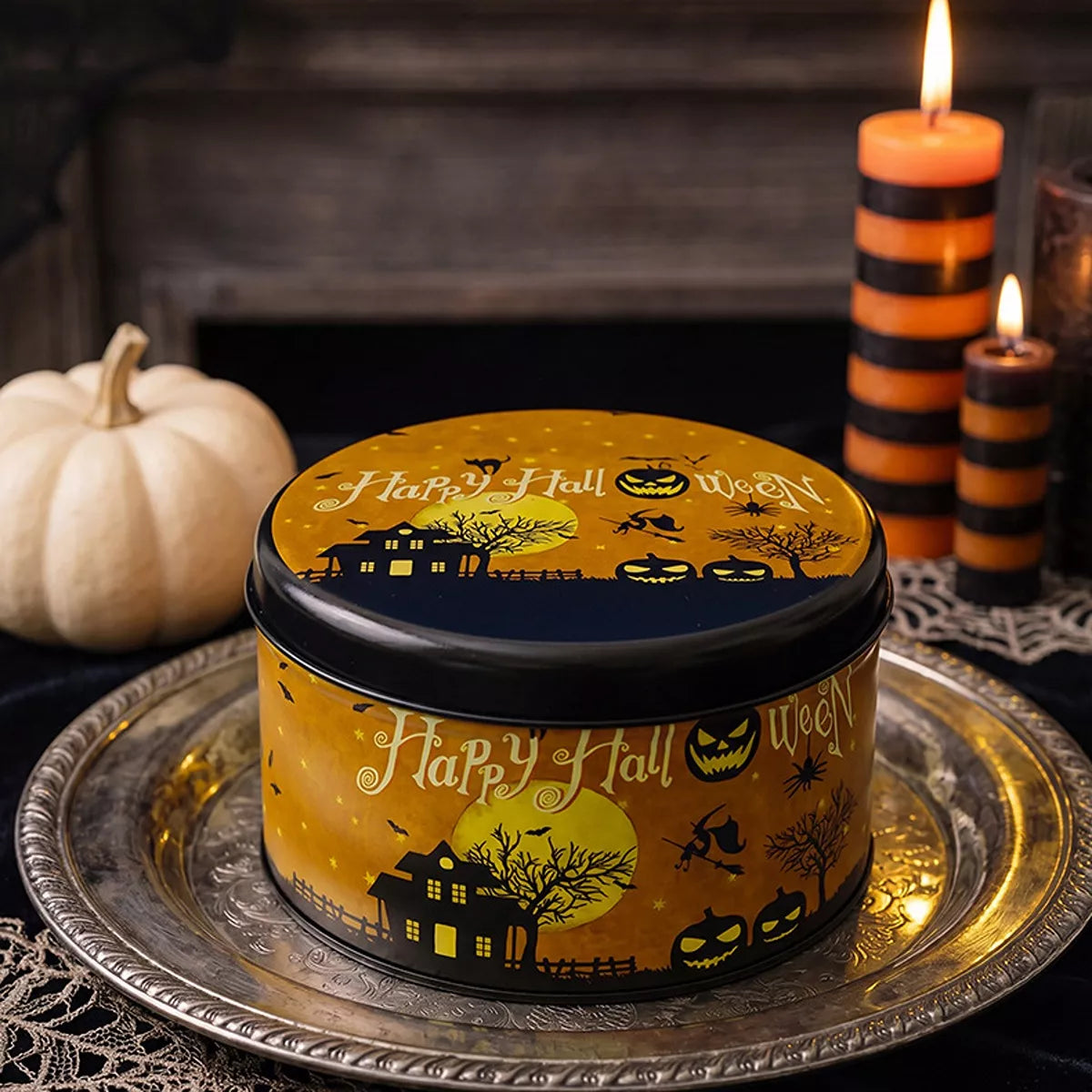 Decorative metal candy tin with Halloween-themed design, ideal for storing treats, by Trendsi.