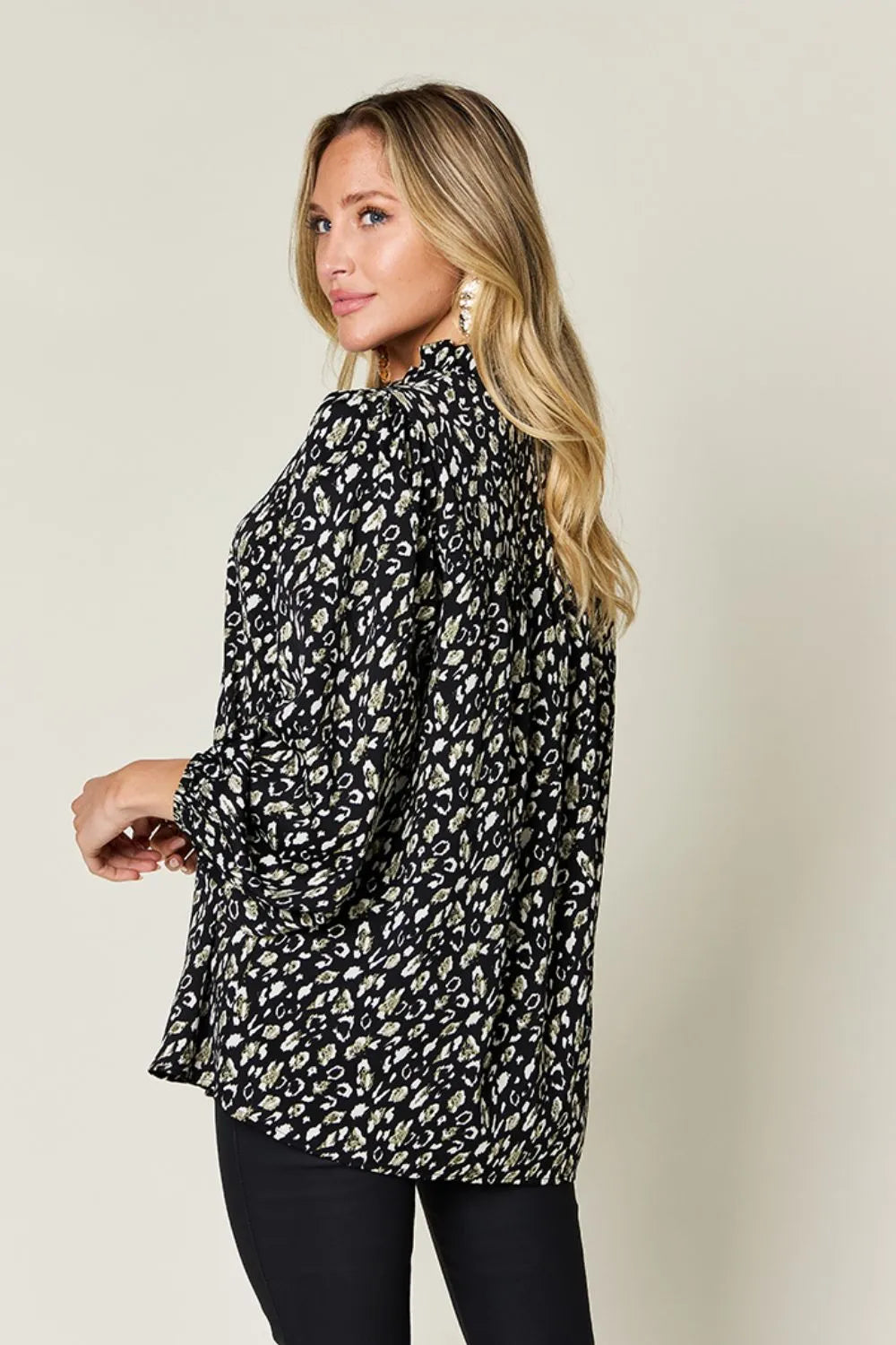 Plus size Leopard Long Sleeve Blouse by Trendsi, featuring a stylish full-size fit and bold animal print design.