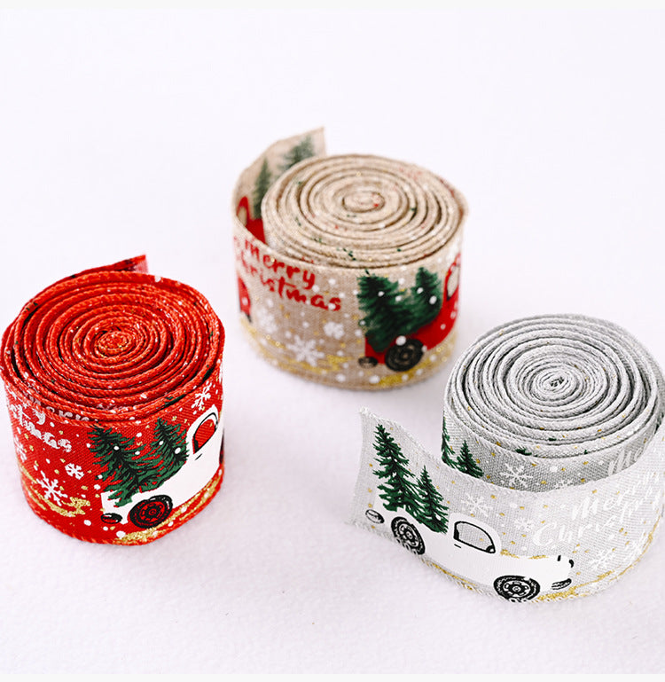 Red and green Christmas ribbon with car and tree design, ideal for holiday decoration, from Trendsi.