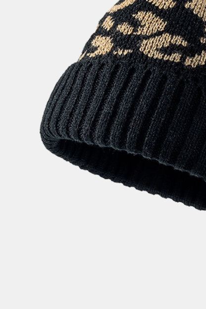 Leopard print pom-pom cuffed beanie by Trendsi featuring a cozy knit design with playful leopard patterns and fluffy pom-pom on top
