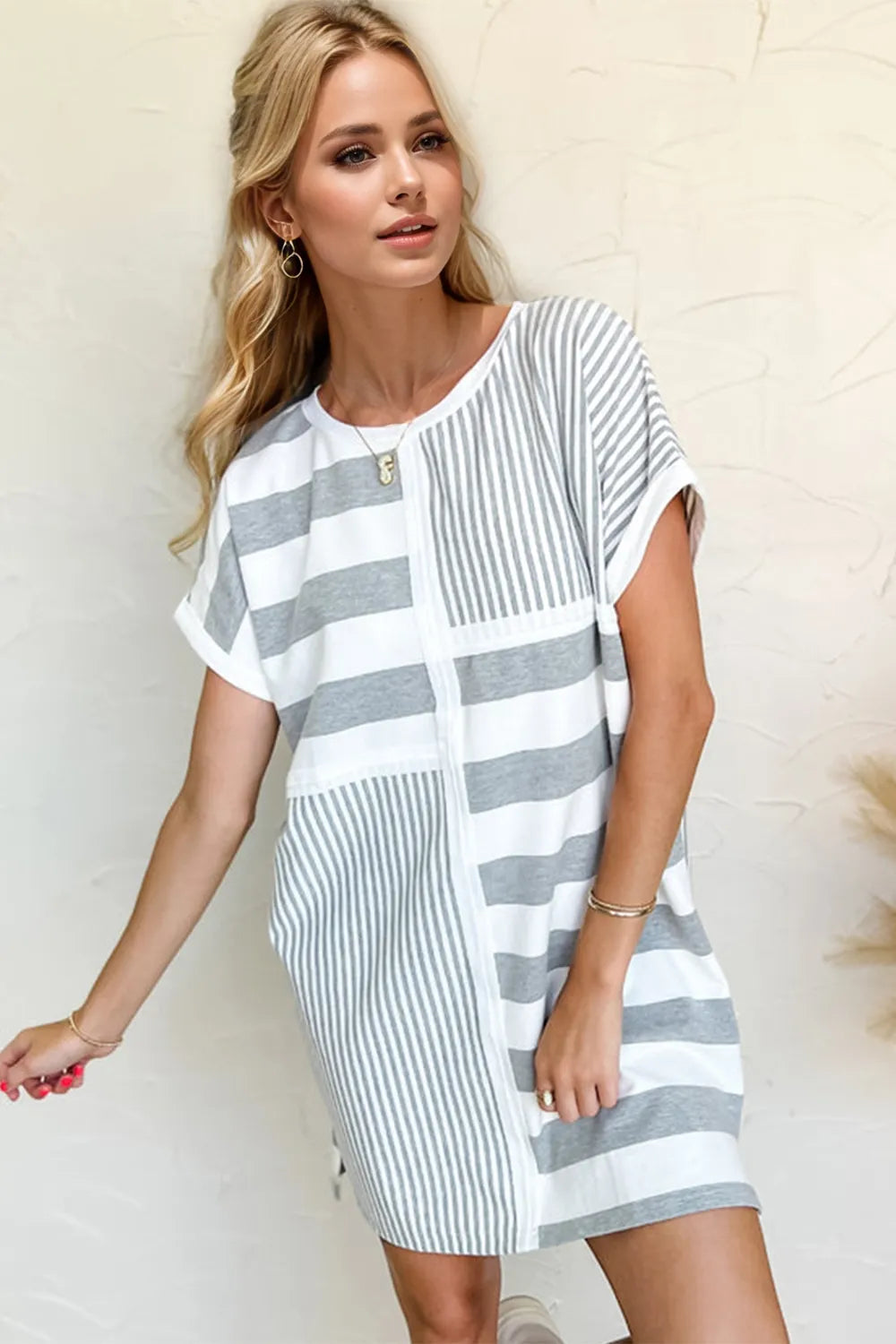 Striped Oh Full Size mini tee dress with round neck and short sleeves, casual style from Trendsi displayed on a mannequin.