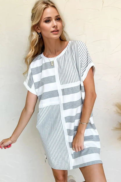 Striped Oh Full Size mini tee dress with round neck and short sleeves, casual style from Trendsi displayed on a mannequin.