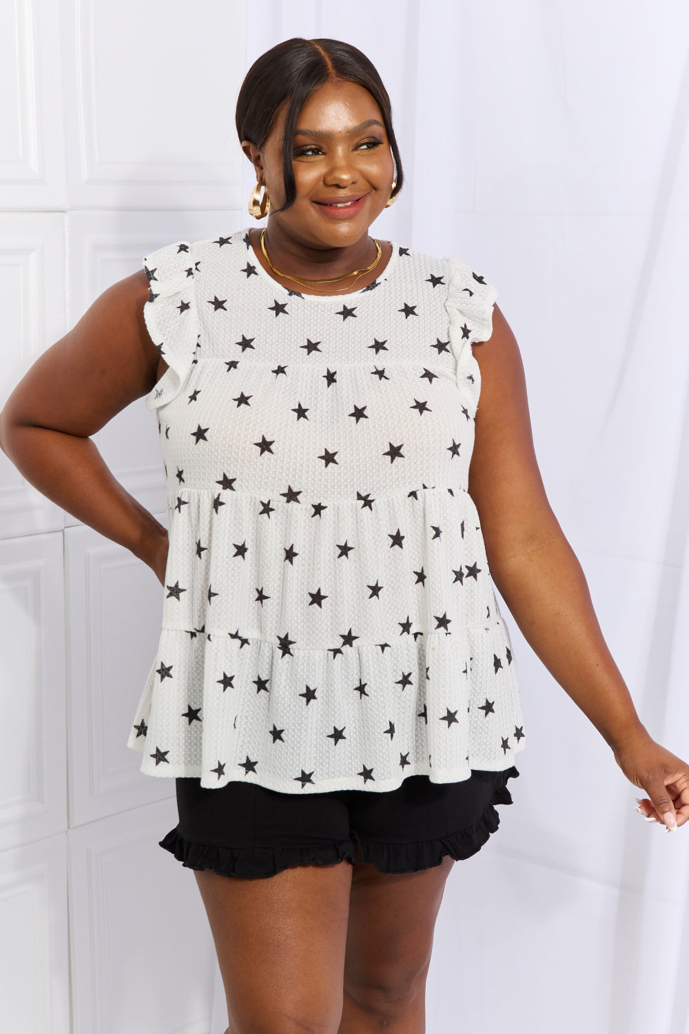 Heimish Shine Bright butterfly sleeve star print top in full size, featuring a stylish design with star patterns and butterfly sleeves.