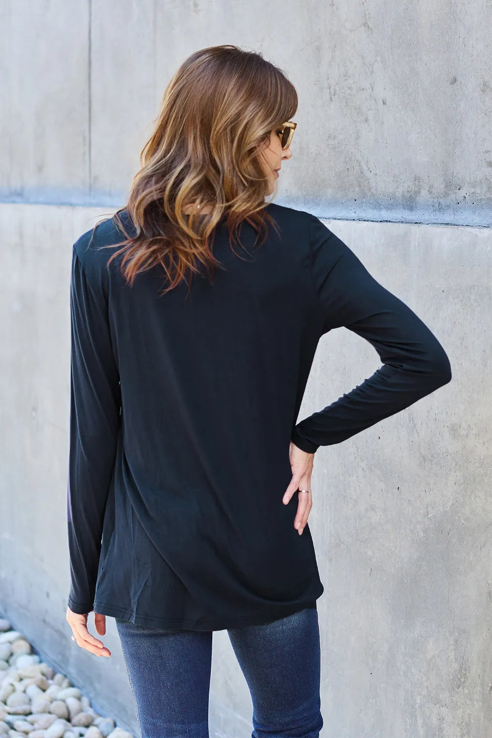 Basic Bae full-size round neck long sleeve top by Trendsi, shown in black with a close-up of the soft fabric and classic fit.