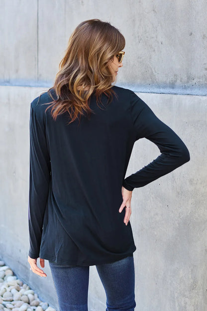 Basic Bae full-size round neck long sleeve top by Trendsi, shown in black with a close-up of the soft fabric and classic fit.
