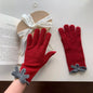 Pink knit gloves with bow decoration, trendy winter accessories from Trendsi, featuring soft fabric and charming design.