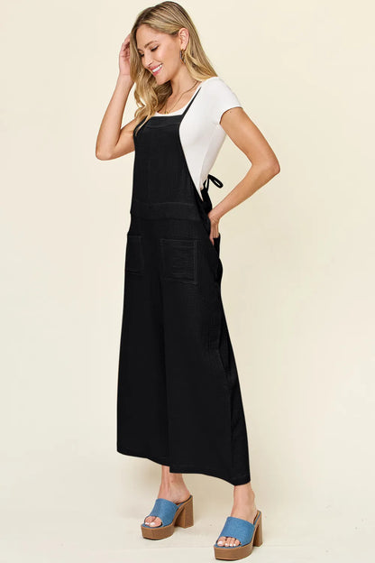 Trendsi Double Take full size texture sleeveless wide-leg overall, featuring a stylish, relaxed fit and textured fabric.