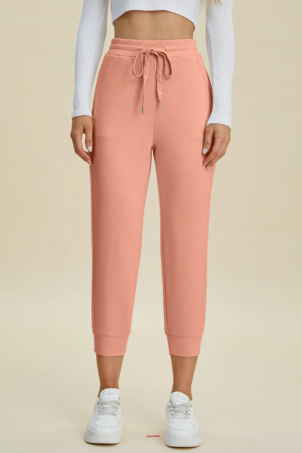 Trendsi Basic Bae full-size air scuba drawstring high waist cropped pants in black, with a relaxed fit and stretchy fabric.