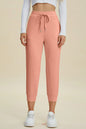 Trendsi Basic Bae full-size air scuba drawstring high waist cropped pants in black, with a relaxed fit and stretchy fabric.