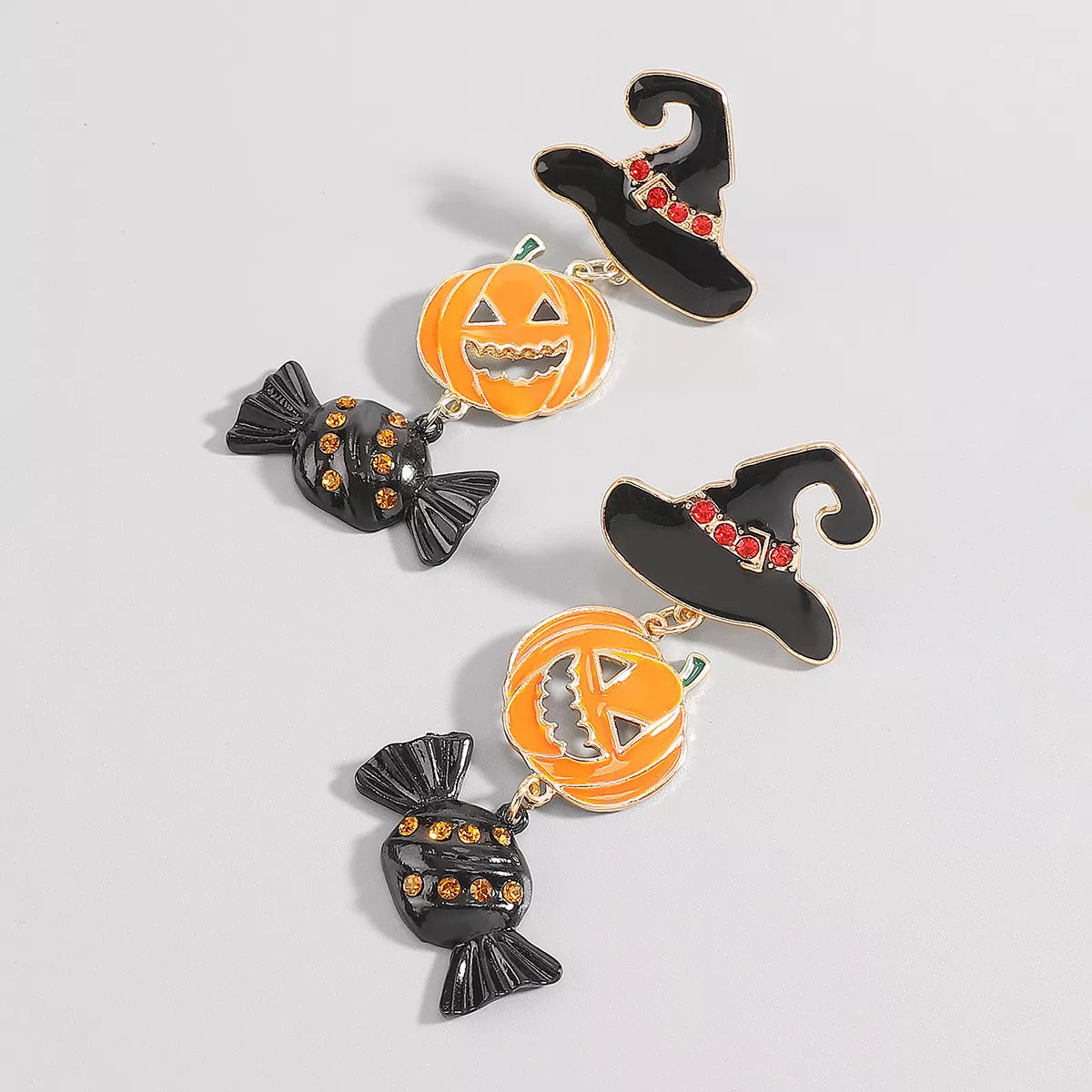 Halloween pumpkin earrings in 18K gold-plated alloy featuring festive orange pumpkin design and intricate detailing.