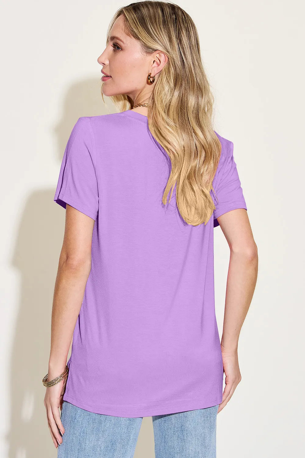 Basic Bae Bamboo V-Neck High-Low T-Shirt by Trendsi, full-size, in natural bamboo fabric, featuring a relaxed fit and stylish V-neck design.