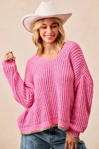 BiBi V-neck sweater by Trendsi featuring colorful trim, shown in a cozy knit fabric with vibrant accents and a classic V-neck design.