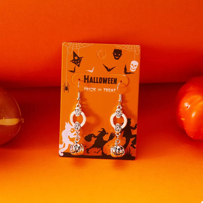 Halloween pumpkin dangle earrings with orange and black details, featuring spooky pumpkin designs, perfect for festive accessories.