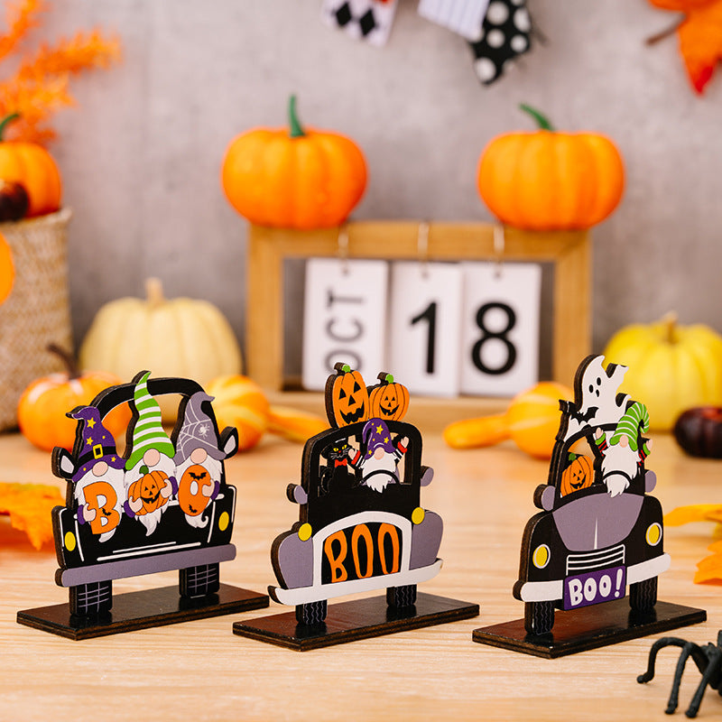 Three Halloween-themed car shape ornaments in orange, black, and white, featuring spooky designs for festive vehicle decoration.