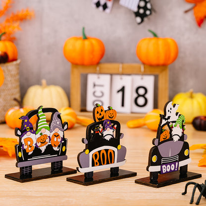 Three Halloween-themed car shape ornaments in orange, black, and white, featuring spooky designs for festive vehicle decoration.