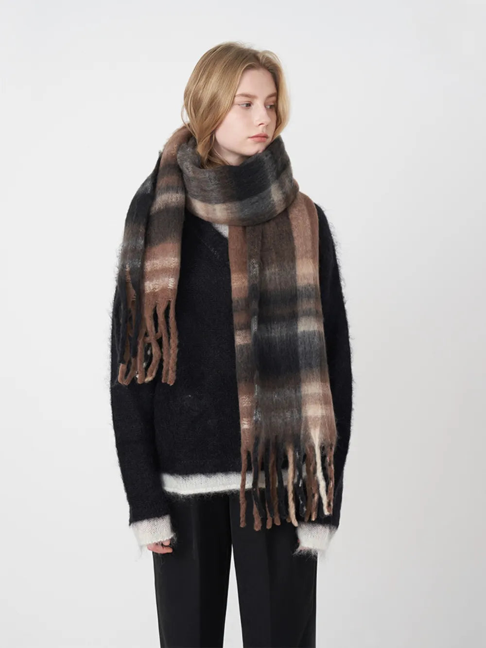 Polyester plaid scarf with fringed edges from Trendsi, featuring a stylish pattern and soft texture for versatile wear.