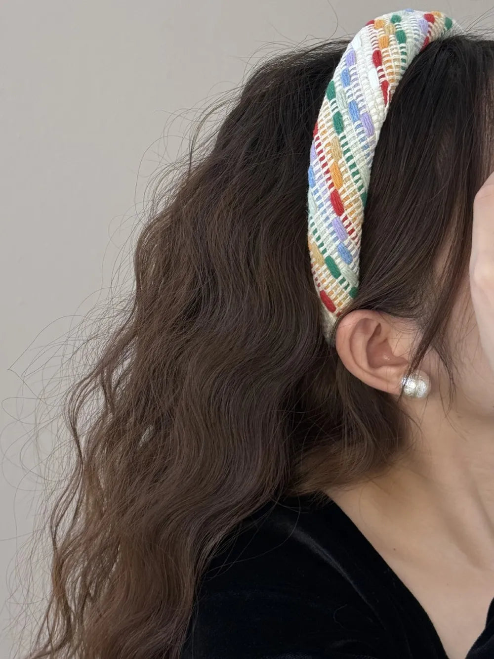 Colorful polyester hair headband by Trendsi with vibrant patterns, perfect for accessorizing and adding a pop of color to hairstyles.