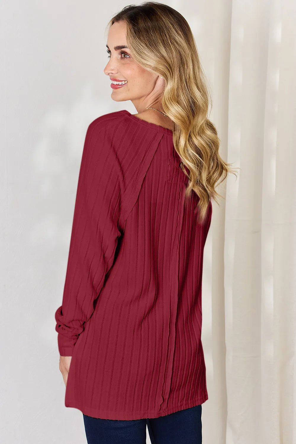 Basic Bae full-size ribbed round neck slit T-shirt by Trendsi, featuring a close-up of the ribbed fabric and slit detail.