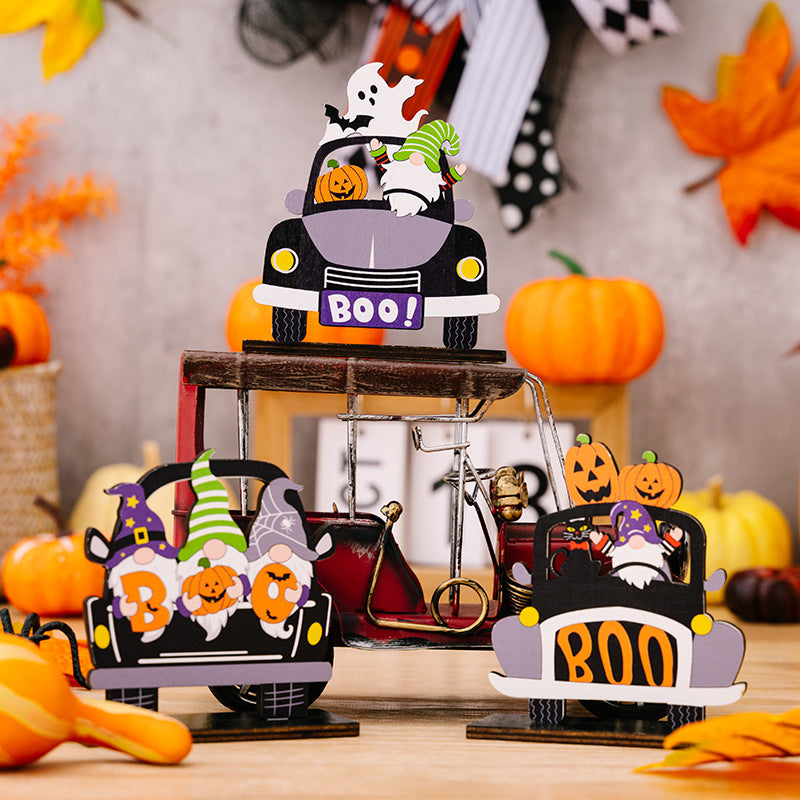 Three Halloween-themed car-shaped ornaments in orange, black, and white with spooky designs, perfect for seasonal decoration.