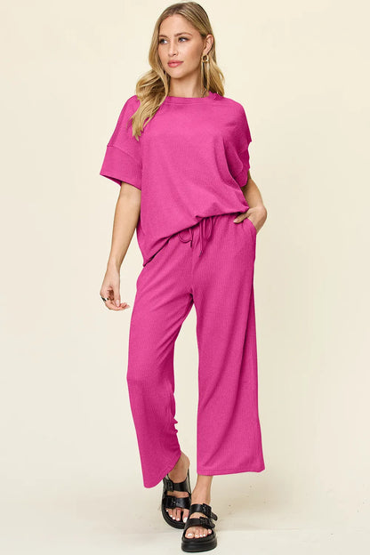 Trendsi double take full size texture round neck short sleeve t-shirt with wide leg pants, styled together in a casual outfit.