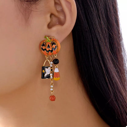 Halloween pumpkin drop earrings featuring orange pumpkin charms with black accents, perfect for festive fall accessorizing.