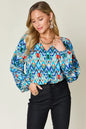 Printed balloon sleeve blouse from Trendsi featuring a double take full size design with bold print and balloon sleeves.