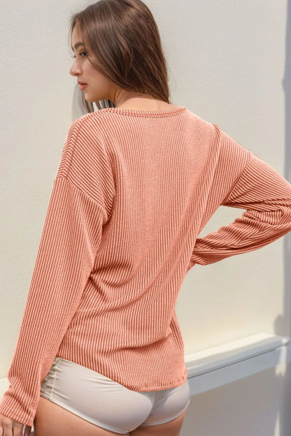 Long sleeve striped notched T-shirt by Trendsi, featuring a stylish design with contrasting stripes and a notched neckline.