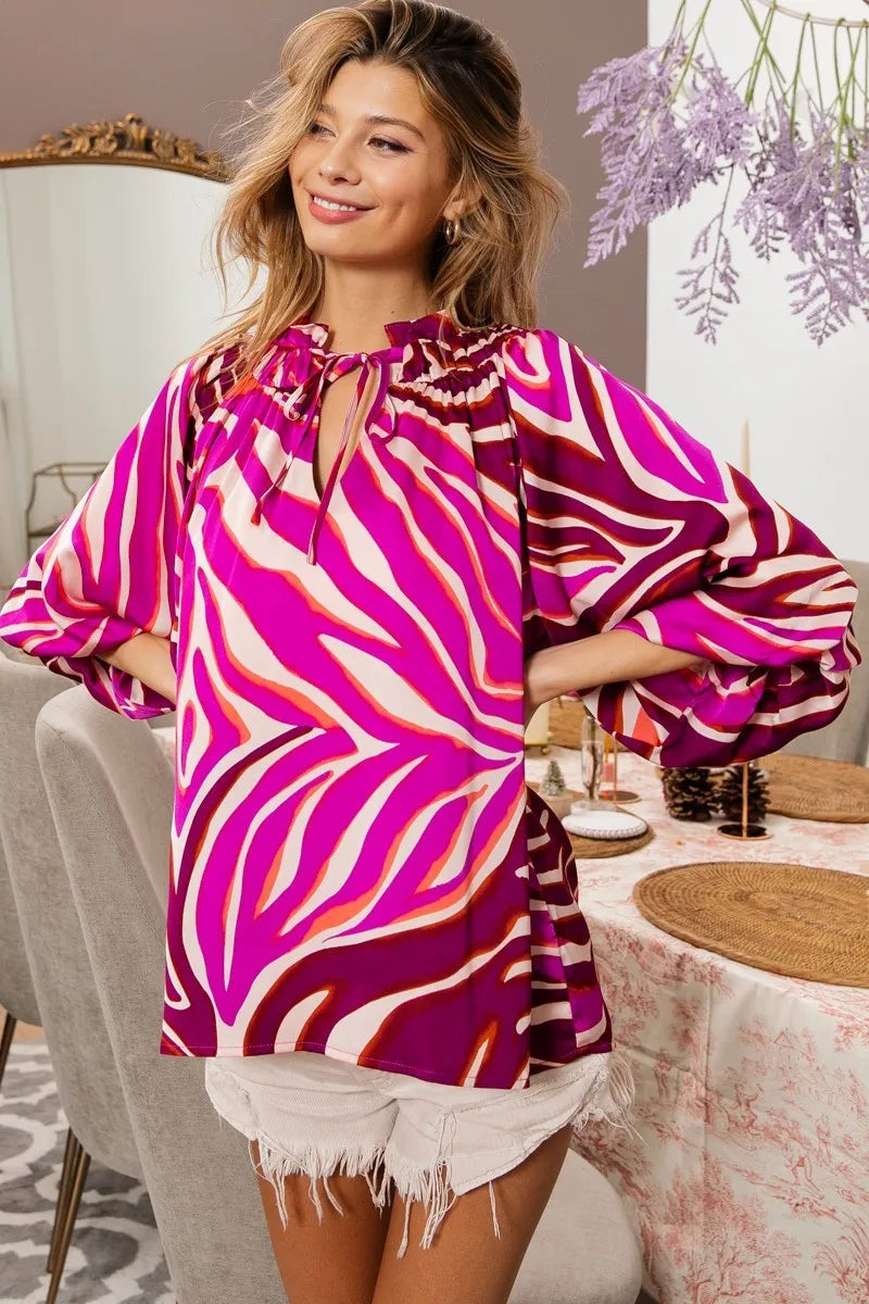 Fuchsia zebra satin top with tied neckline and half balloon sleeves, from Trendsi, styled for a chic, modern look.