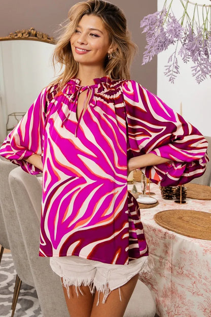 Fuchsia zebra satin top with tied neckline and half balloon sleeves, from Trendsi, styled for a chic, modern look.