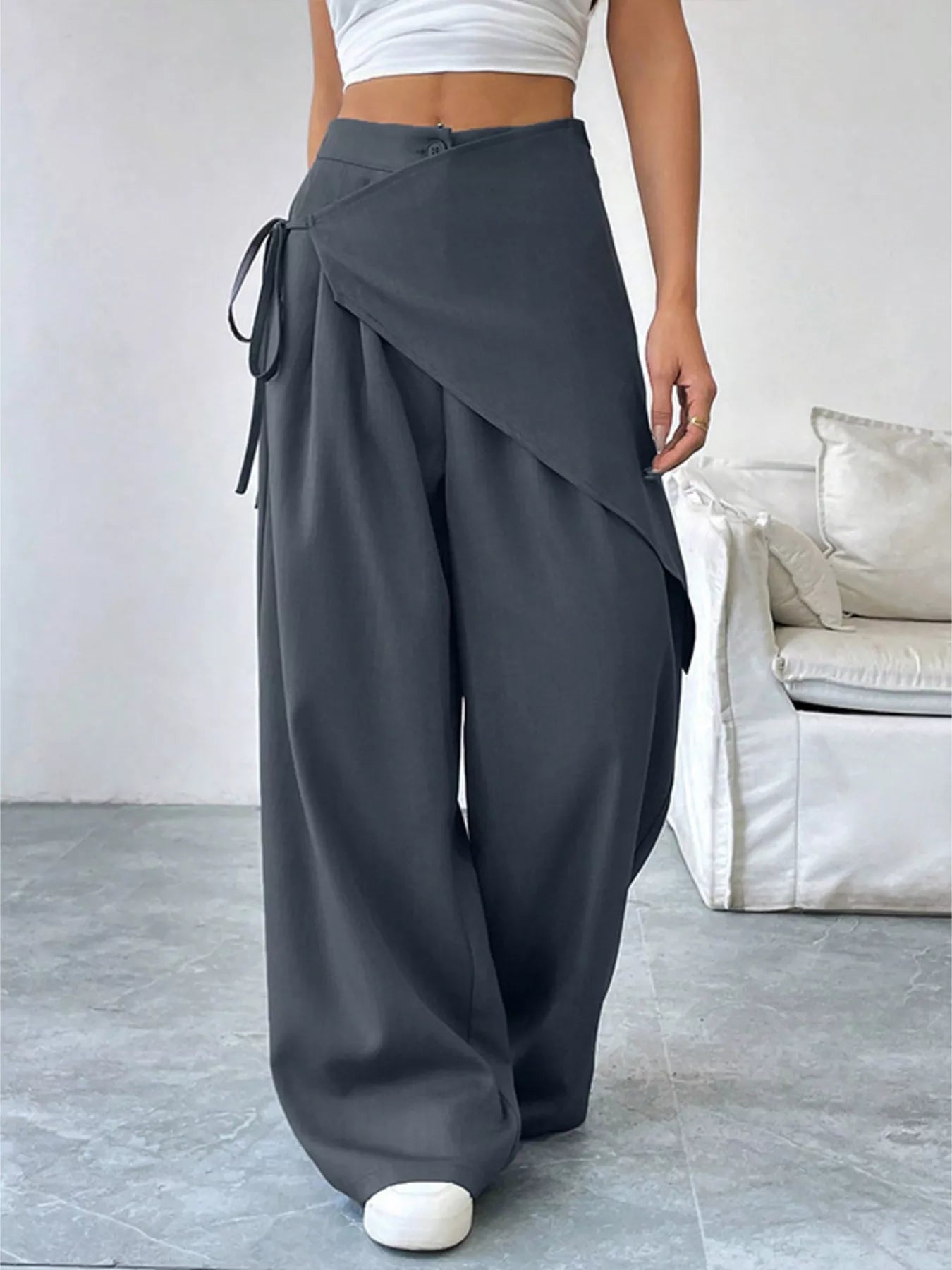 Gray asymmetrical wrap wide-leg pants from Trendsi featuring a flowing, stylish design and relaxed fit.
