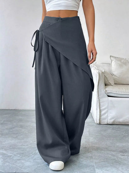 Gray asymmetrical wrap wide-leg pants from Trendsi featuring a flowing, stylish design and relaxed fit.