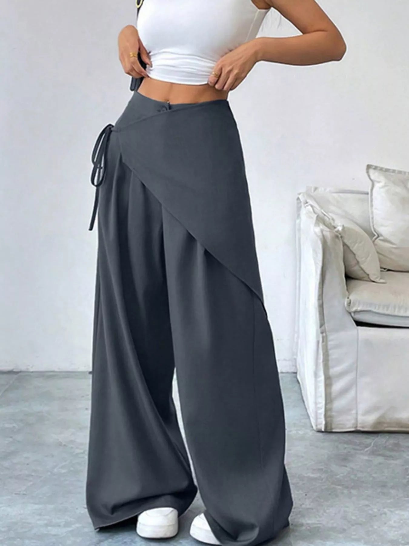 Gray asymmetrical wrap wide-leg pants by Trendsi, featuring a stylish flowy silhouette and unique wrap design.