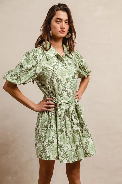 Green and cream floral short sleeve mini shirt dress by Trendsi with a tied waist and casual, feminine style.