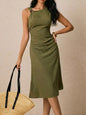 Green asymmetrical neck ruched midi dress by Trendsi featuring a fitted silhouette and elegant draping details.