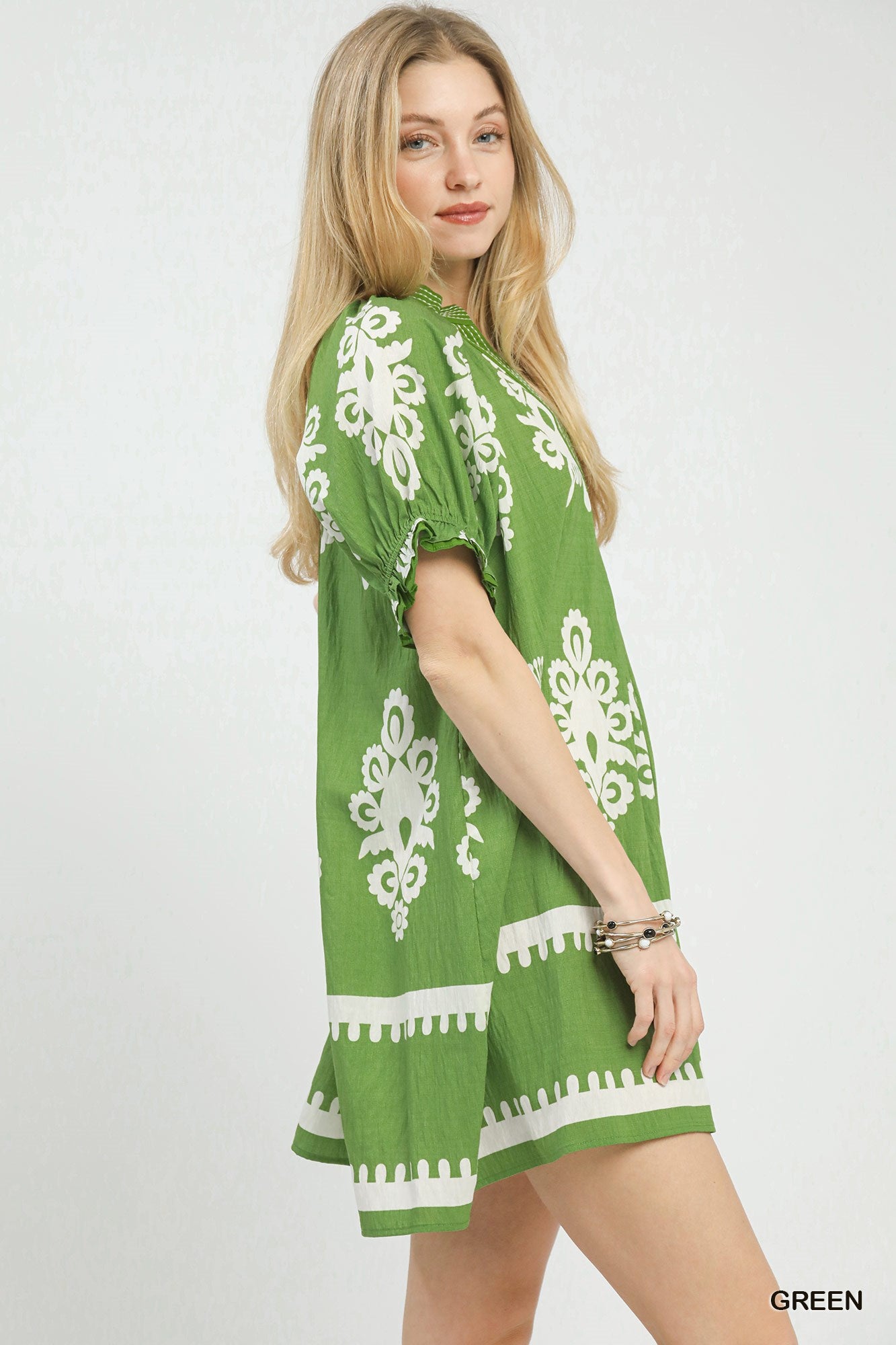 Green Umgee two-tone border print mini dress with short sleeves and relaxed fit, perfect for casual summer wear.