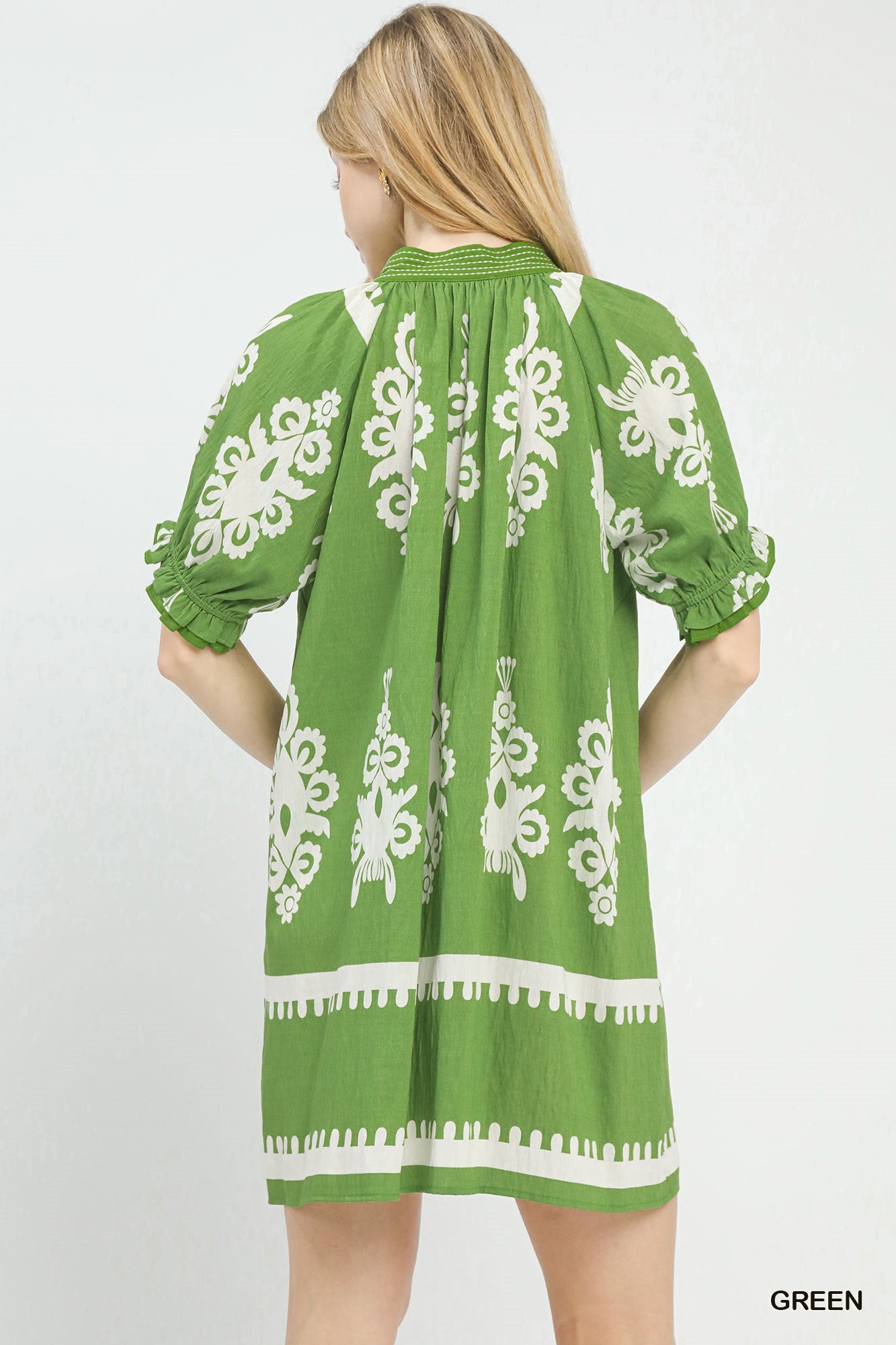 Green Umgee two-tone border print mini dress with short sleeves and casual style, perfect for warm weather.
