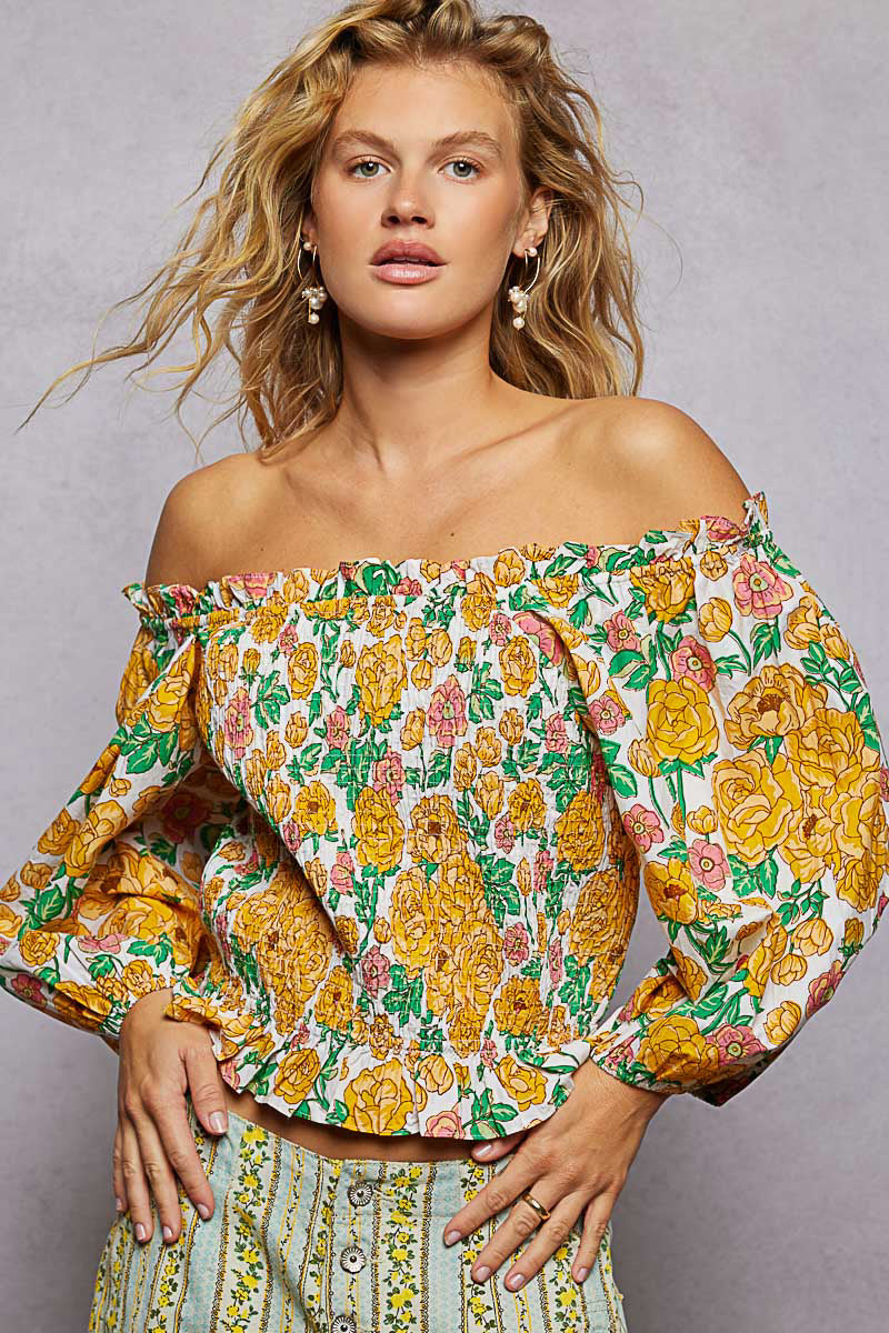 Honey-multi floral print off-shoulder smocked blouse from Trendsi, featuring a feminine design with ruffled sleeves and a relaxed fit.