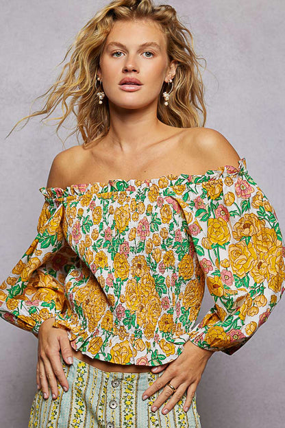Honey-multi floral print off-shoulder smocked blouse from Trendsi, featuring a feminine design with ruffled sleeves and a relaxed fit.