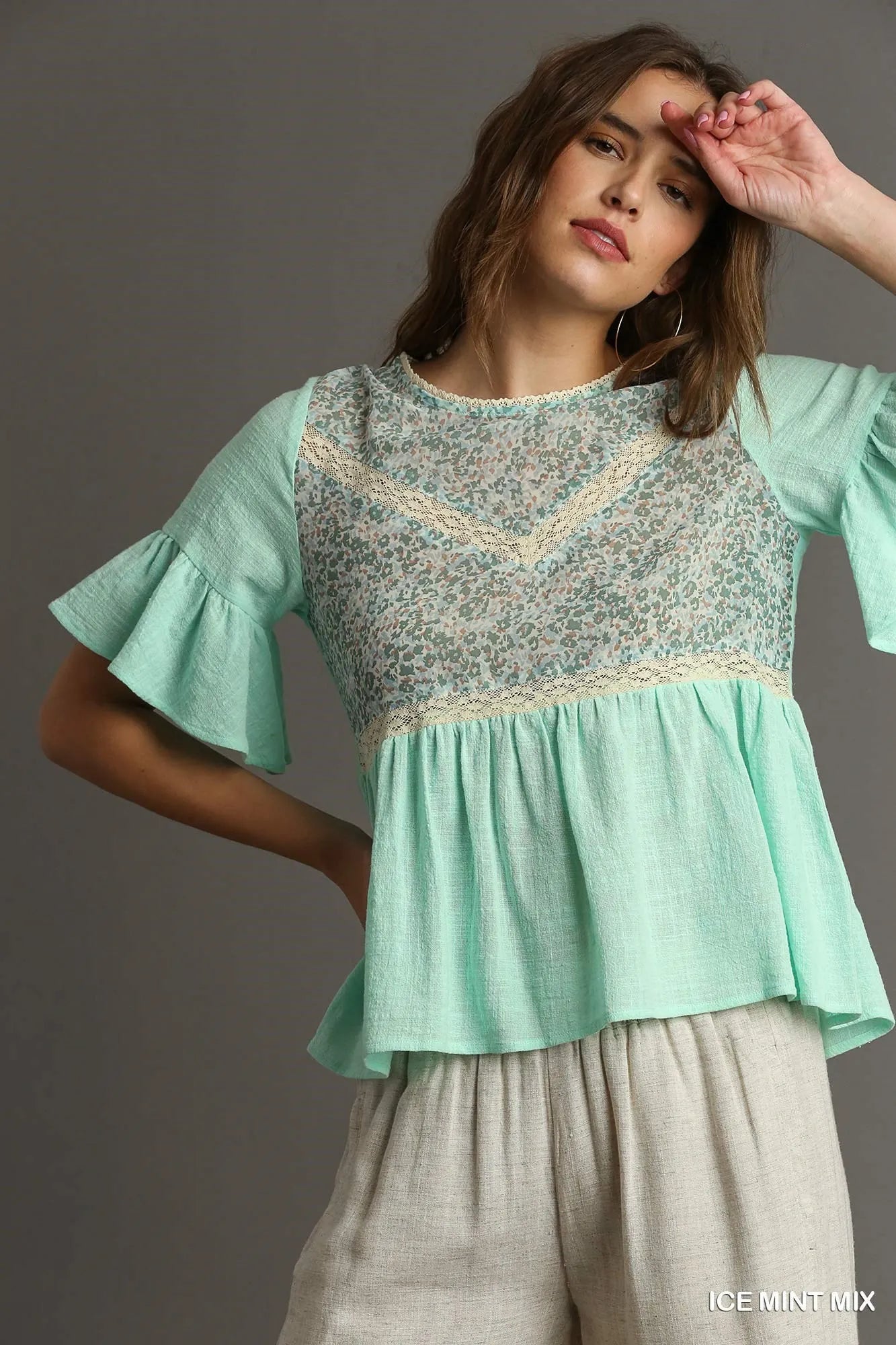 Ice mint floral lace-trimmed babydoll top with half sleeves by Umgee, featuring a flowy, feminine design and delicate lace details.