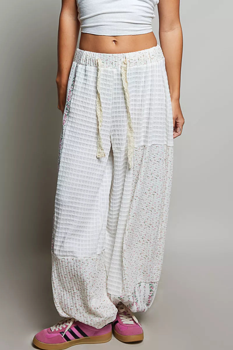 Ivory multi-color patchwork mixed knit wide-leg pants from Trendsi, showcasing their relaxed fit and stylish design.