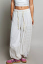 Ivory multi-color patchwork mixed knit wide-leg pants from Trendsi, showcasing their relaxed fit and stylish design.