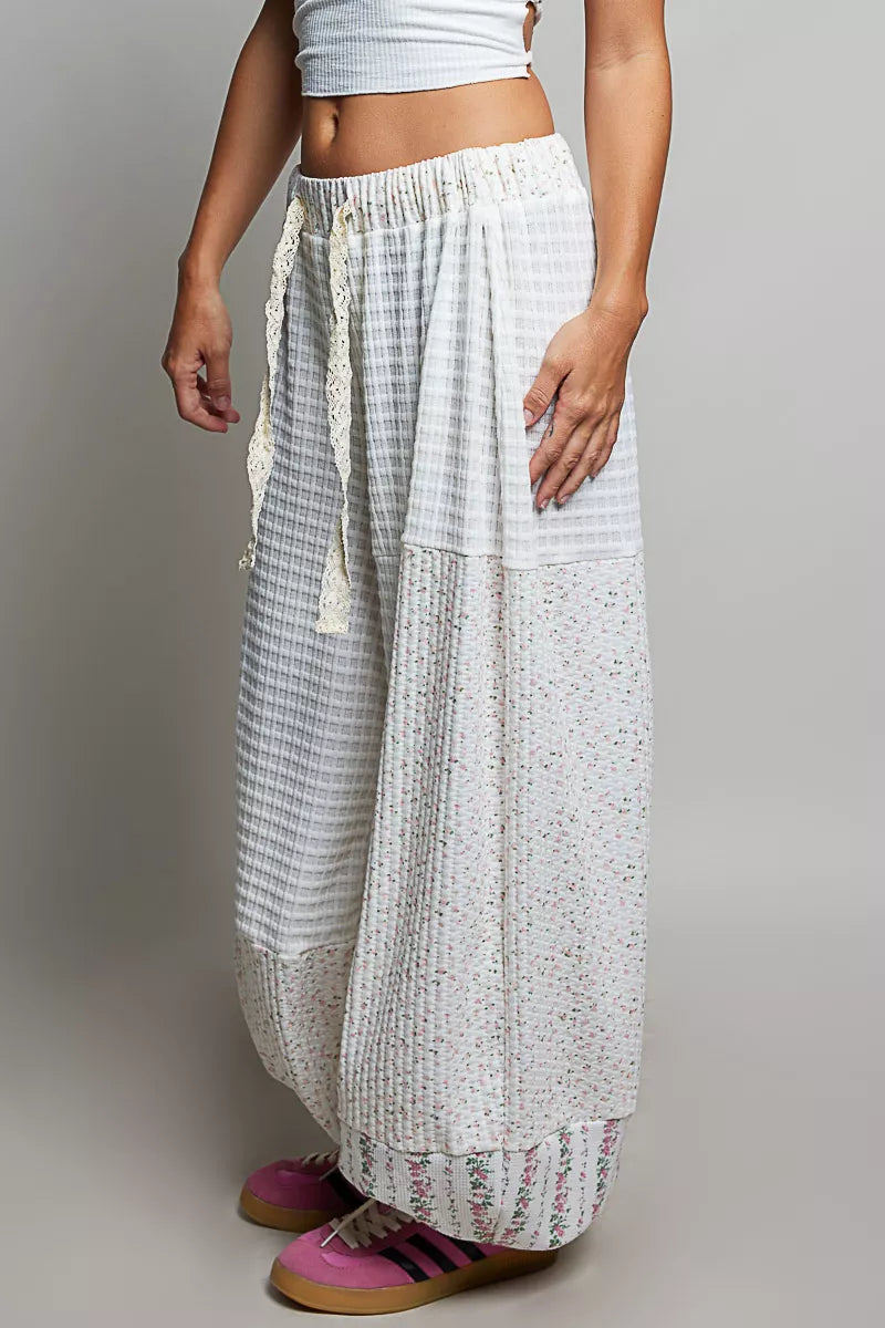 Ivory multi-color patchwork knit wide-leg pants by Trendsi featuring a relaxed fit and mixed knit fabric for a stylish look.