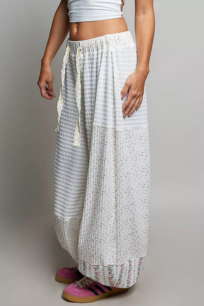 Ivory multi-color patchwork knit wide-leg pants by Trendsi featuring a relaxed fit and mixed knit fabric for a stylish look.